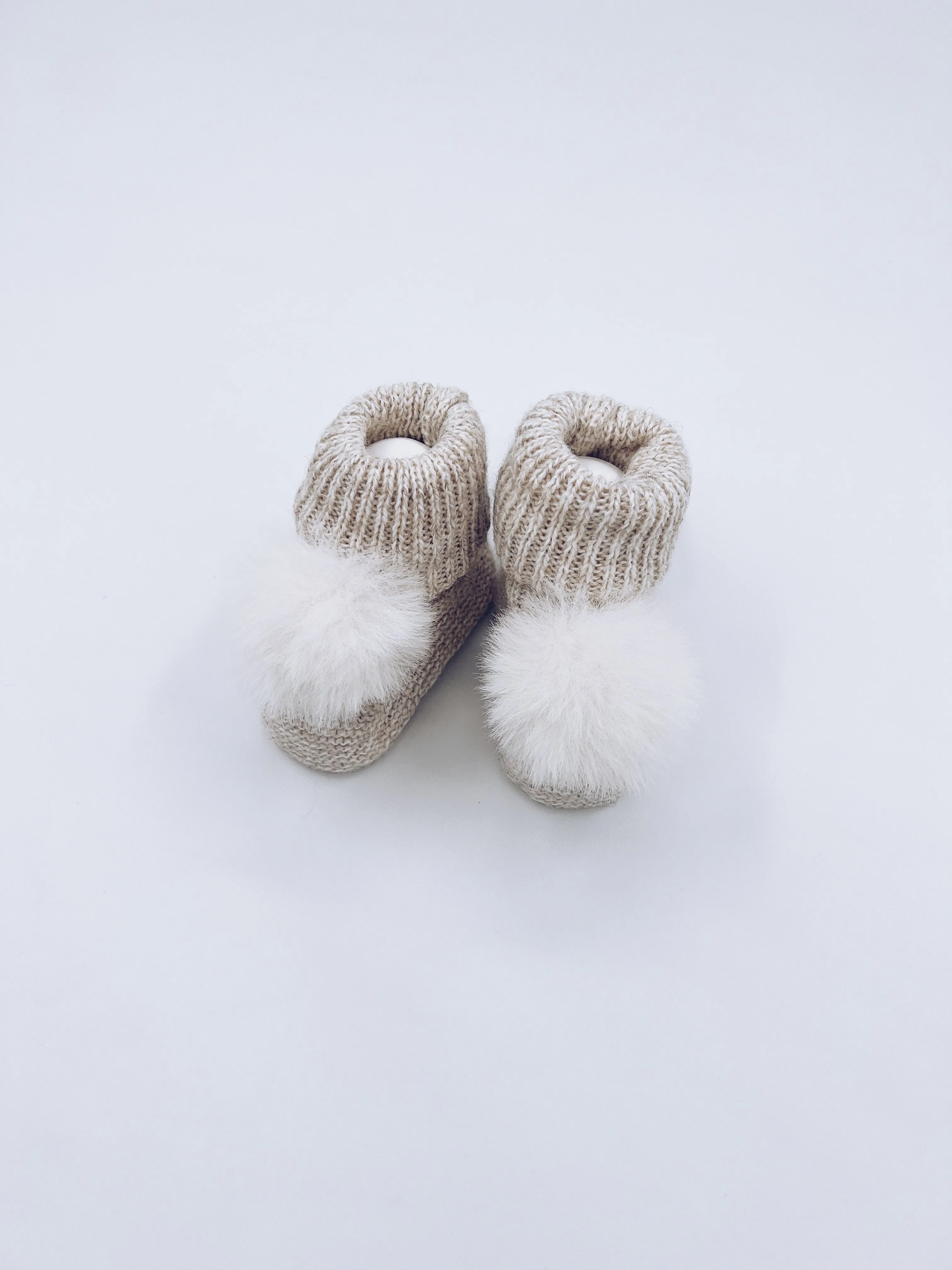 Light Beige knitted Pompom booties.